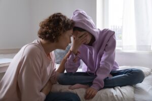 Parent supporting teenager facing juvenile court in California.