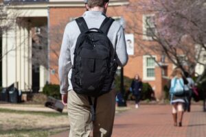 College student walking on campus after expunging his record.